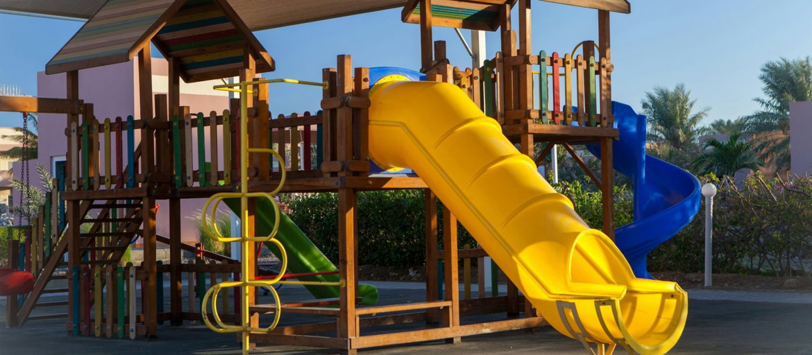yellow and brown playground slide
