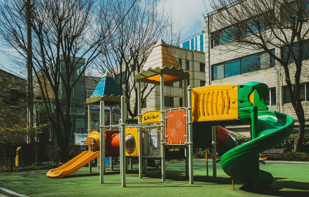 a children's play area in front of a building